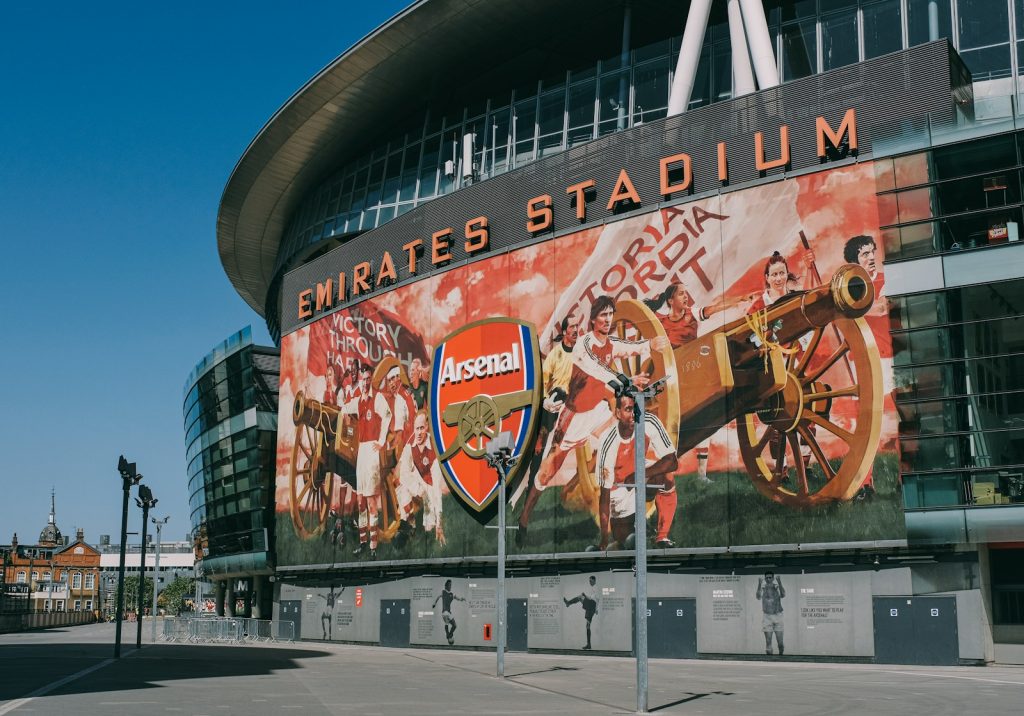 a stadium with a large mural on the side of it